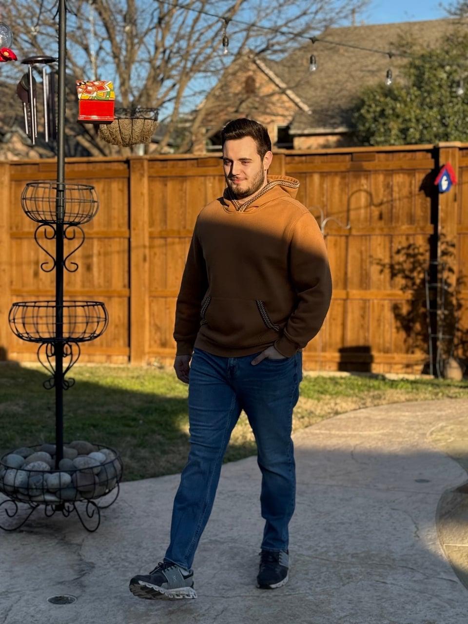 Christopher standing outdoors
